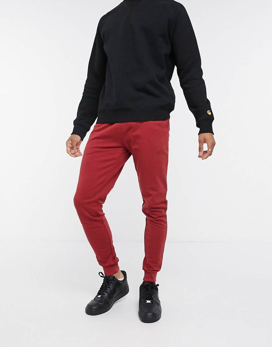 ASOS DESIGN organic skinny sweatpants in red-Black | The Fashionisto