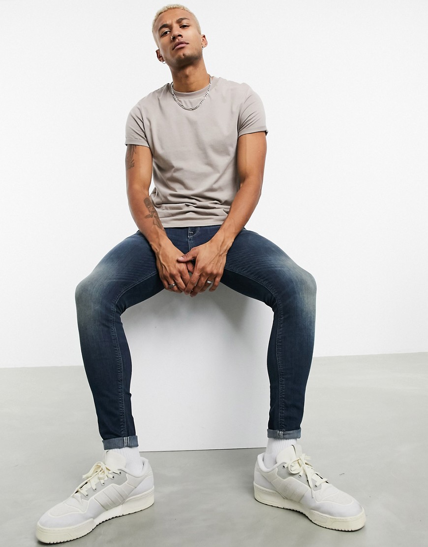 ASOS DESIGN spray on jeans in power stretch denim in tint-Blue | The ...