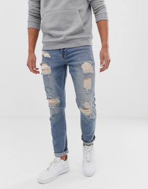 ASOS DESIGN stretch slim jeans in vintage light wash blue with heavy rips ASOS DESIGN stretch slim jeans in vintage light wash blue with heavy rips