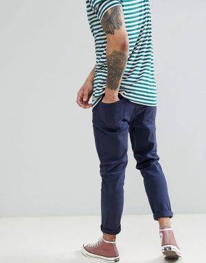 ASOS DESIGN tapered jeans in navy ASOS DESIGN tapered jeans in navy