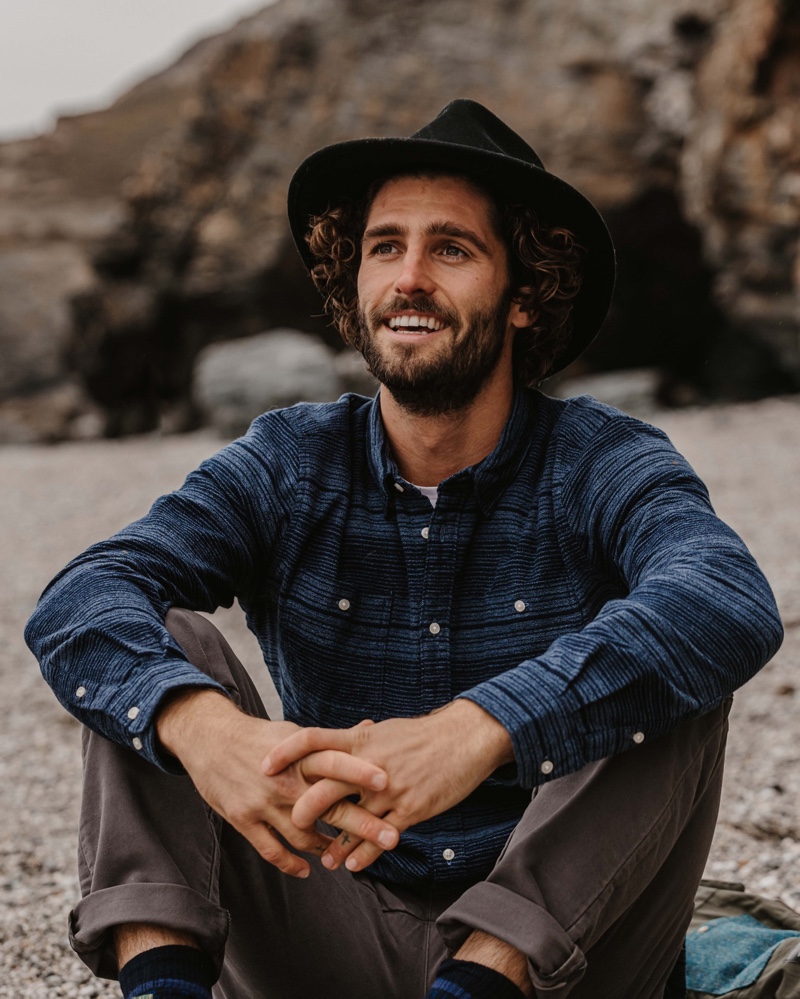 All smiles, Alex Libby wears a fall-winter 2020 look from Barbour.