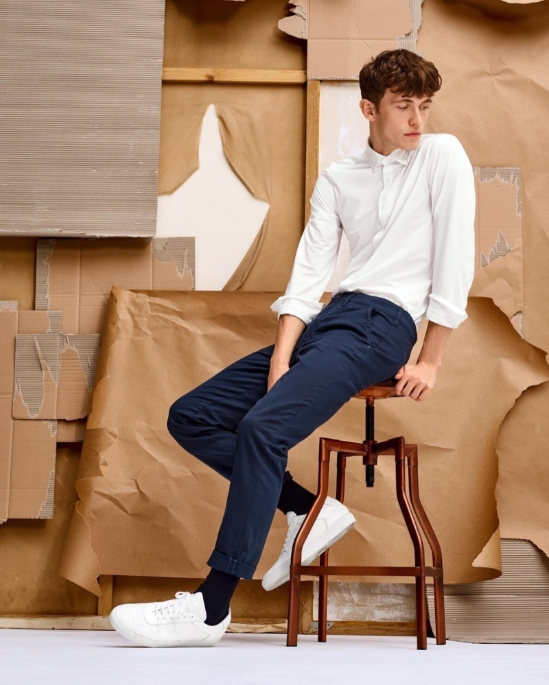 Christoffer Barsø dons a smart and timeless look, consisting of a white shirt and navy chinos, for Anson's fall-winter 2020 campaign.