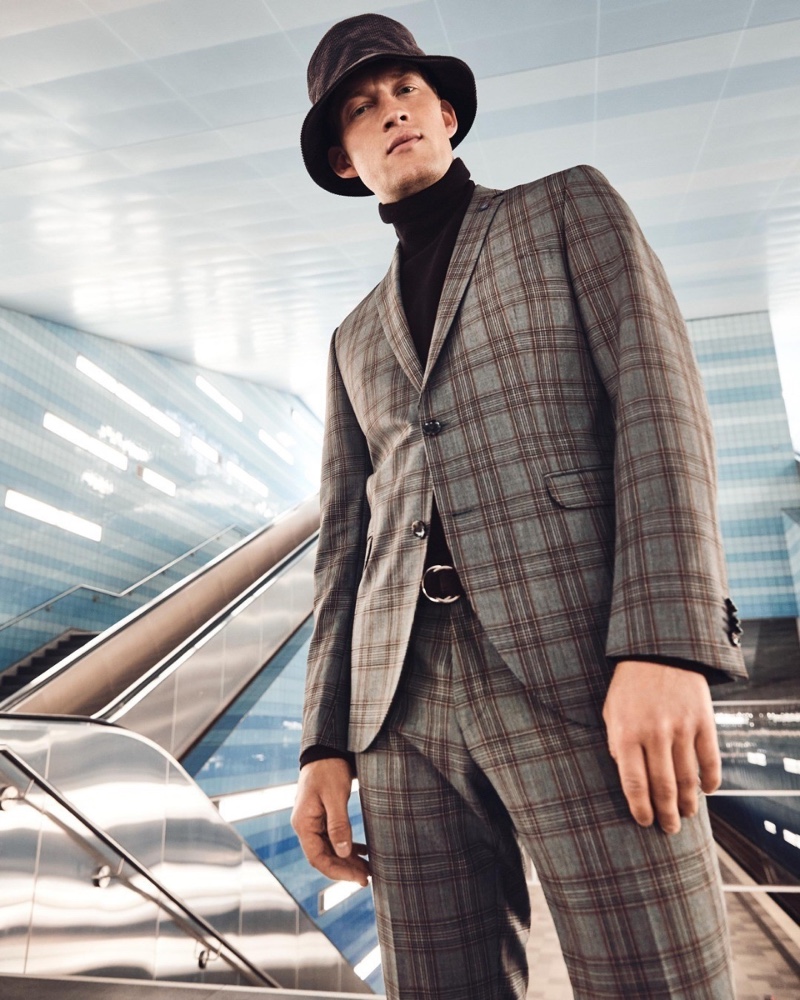 Bastian Thiery sports a checked suit with a turtleneck sweater and bucket hat for Anson's fall-winter 2020 campaign.