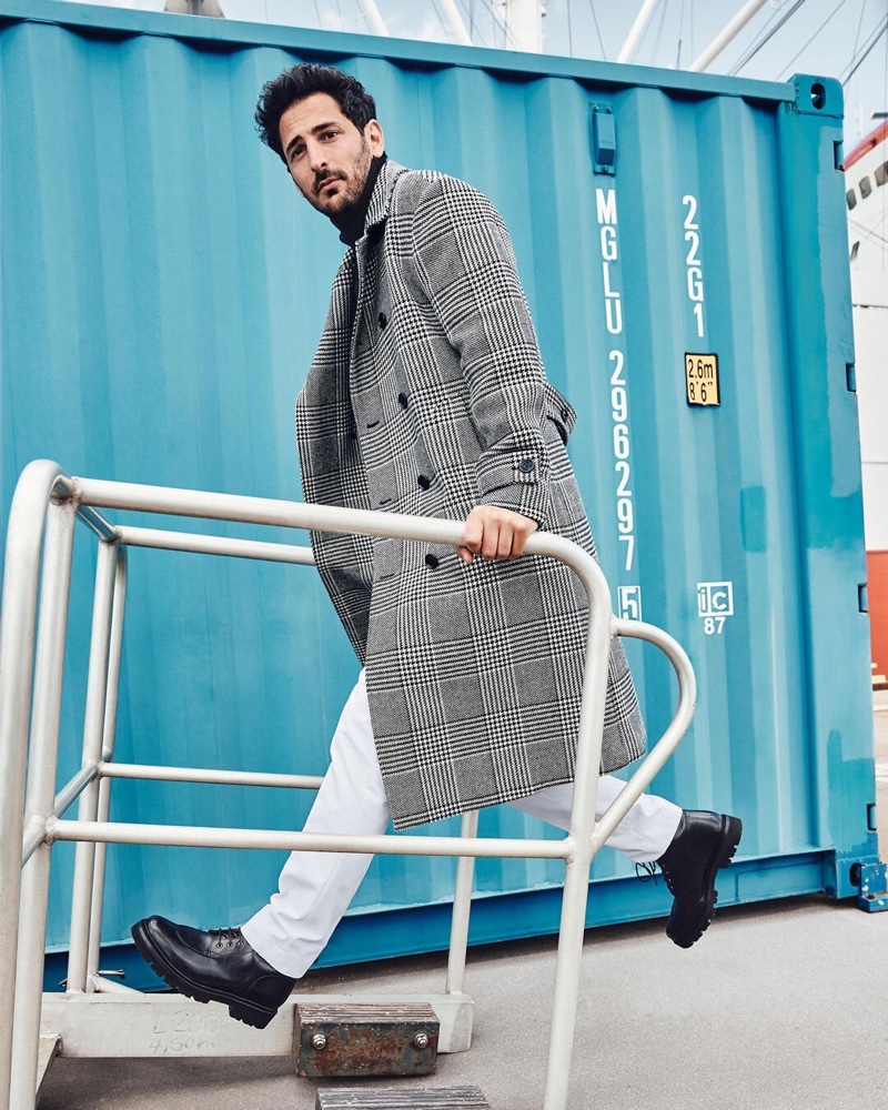 Selle Coskun sports a checked double-breasted coat with Tiger of Sweden chinos for Anson's fall-winter 2020 campaign.