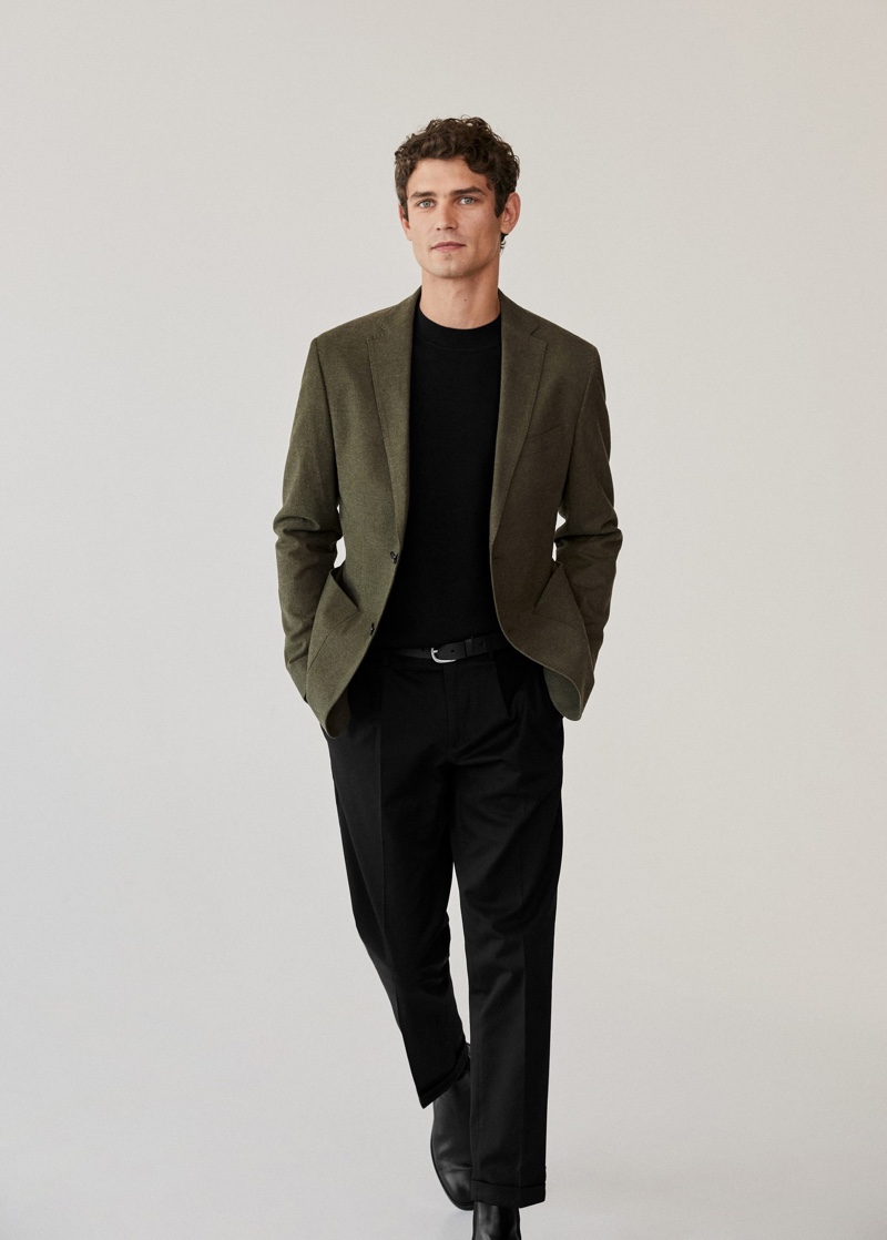 Showcasing smart style from Mango, Arthur Gosse wears a slim-fit cotton blazer with pleated slim-fit chinos.