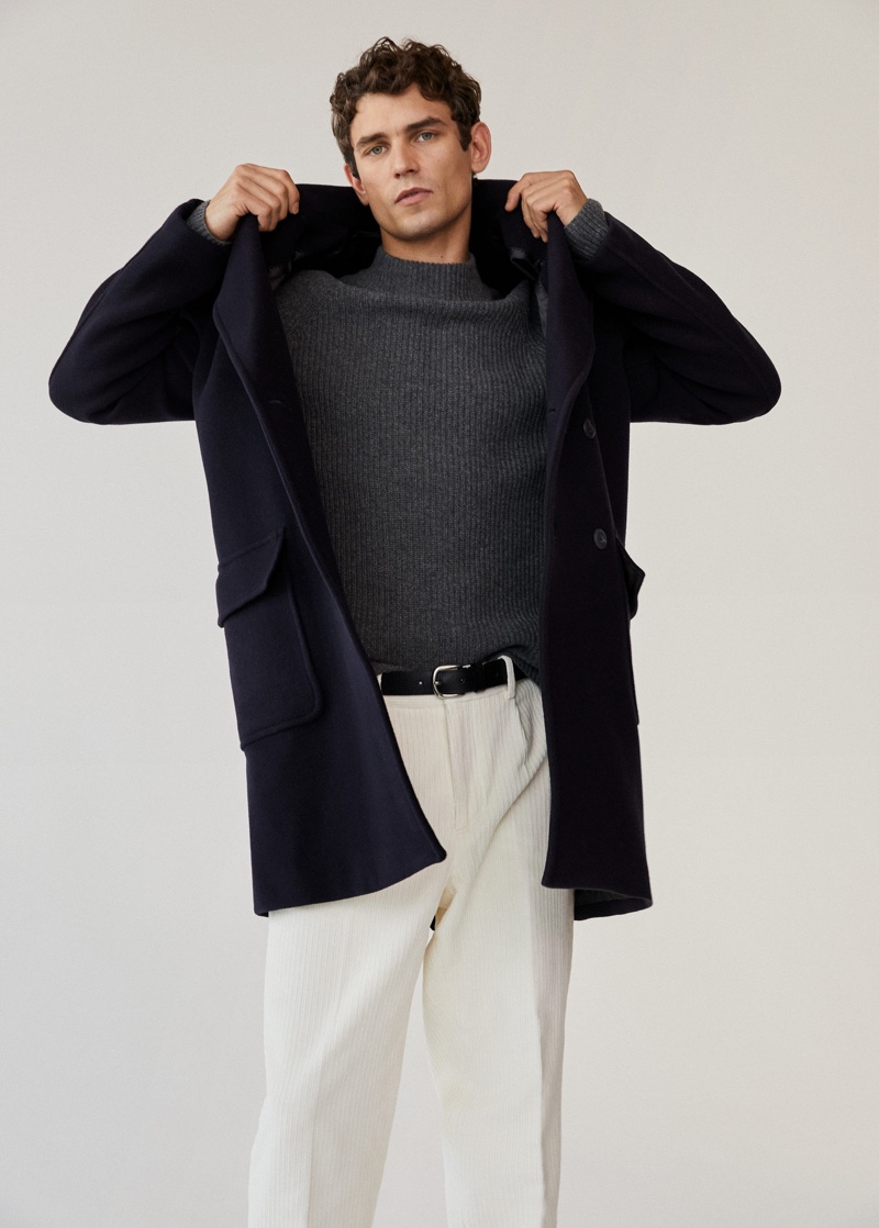 Front and center, Arthur Gosse sports a virgin wool coat with corduroy pants and a ribbed sweater.