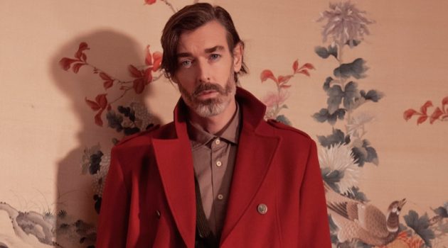 Richard Biedul dons an elegant coat in red for Besilent's fall-winter 2020 campaign.