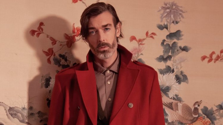 Richard Biedul dons an elegant coat in red for Besilent's fall-winter 2020 campaign.