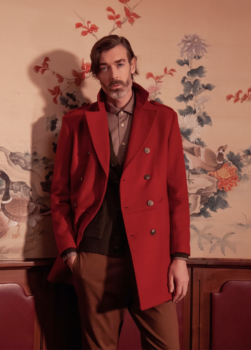 Richard Biedul dons an elegant coat in red for Besilent's fall-winter 2020 campaign.