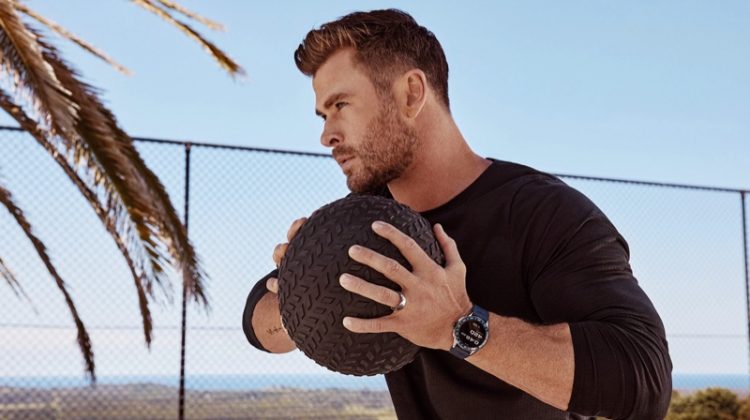 Working out, Chris Hemsworth sports a TAG Heuer Connected watch for the brand's latest advertisement.