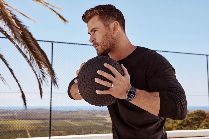 Working out, Chris Hemsworth sports a TAG Heuer Connected watch for the brand's latest advertisement.