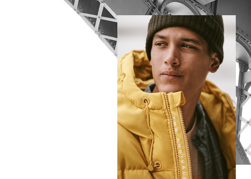 Model Marco Pickett sports an AER classic down puffer jacket in saffron ripstop from The Arrivals.