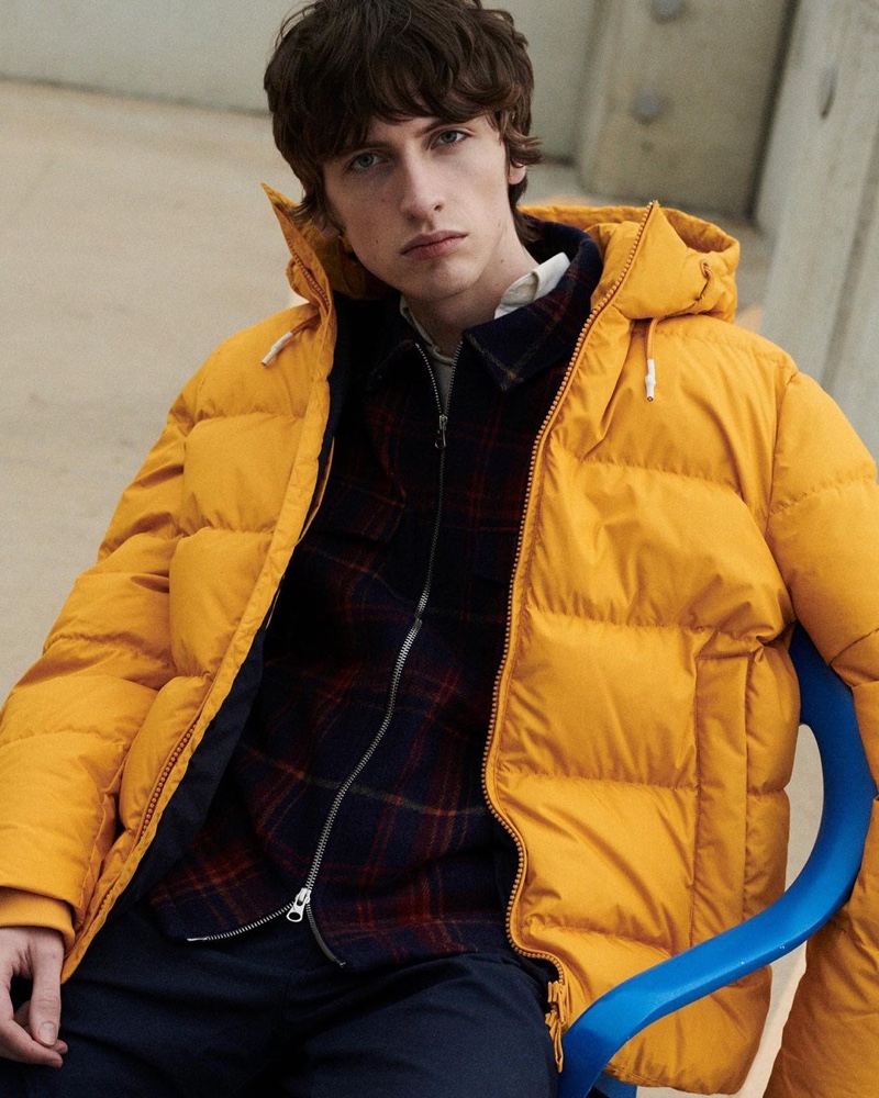 Benno Bulang sports a yellow puffer over a checked jacket for GANT's fall-winter 2020 campaign.