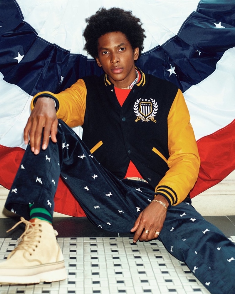 Front and center, Rafael Mieses stands out in a preppy look, complete with a varsity jacket, for GANT's fall-winter 2020 campaign.