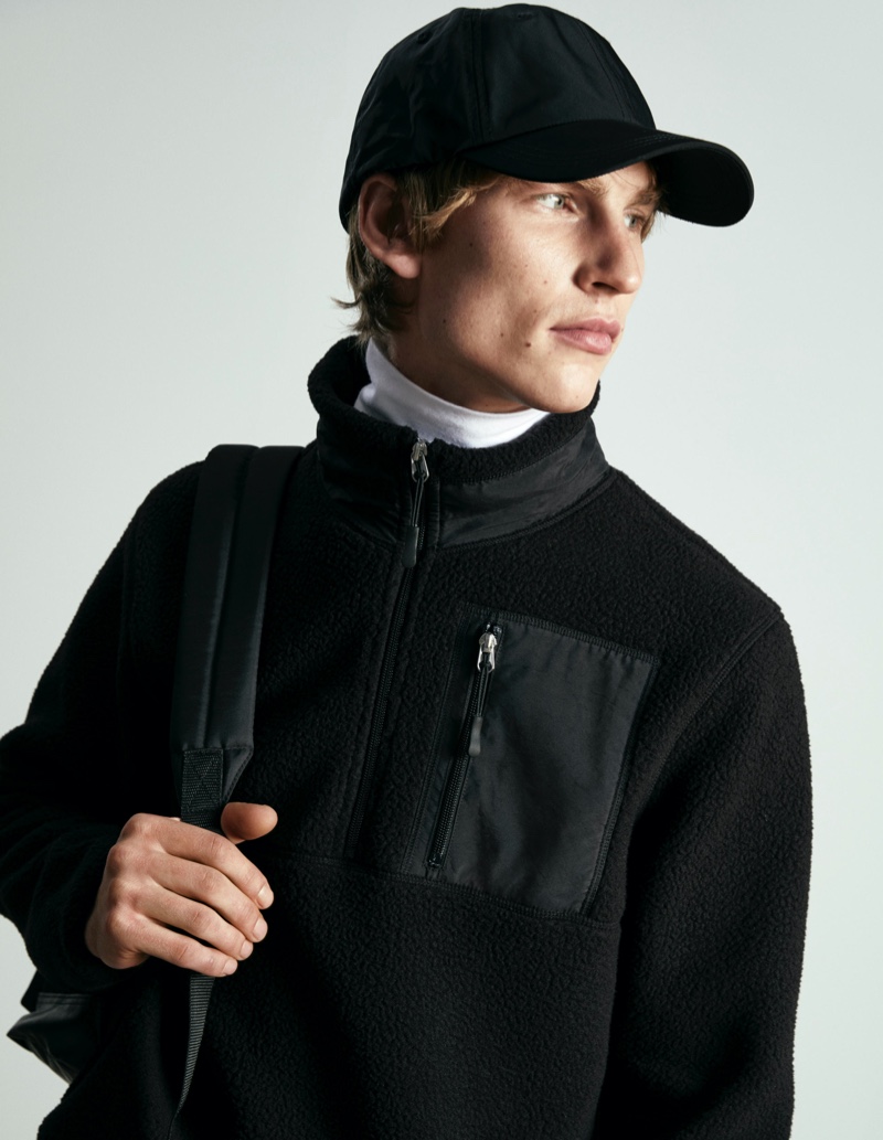 Model Thom Voorintholt dons a Heat Up Tech half-zip pullover from H&M.