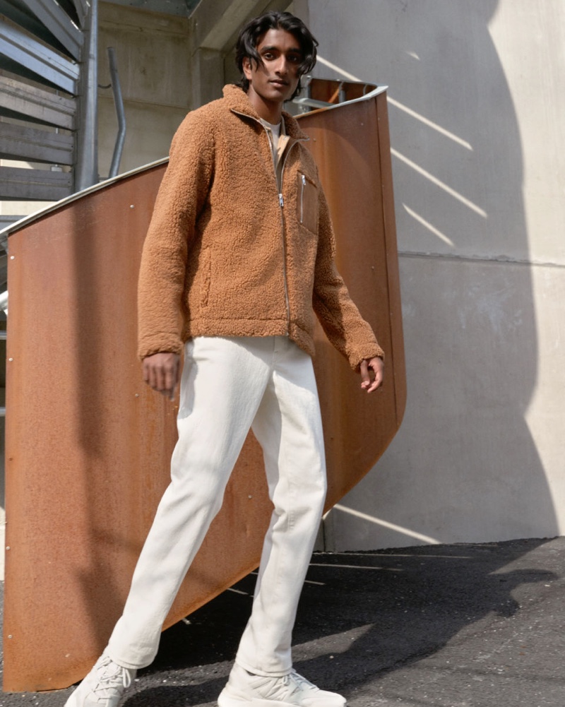 Connecting with H&M for the season, Jeenu Mahadevan models a brown faux shearling jacket.