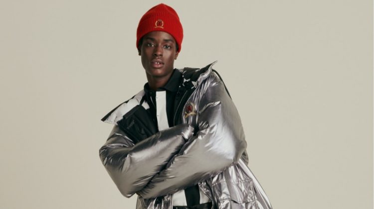 Making a grand style statement, Babacar N'doye dons a Hilfiger Collection reversible Re:Down parka and skinny rock belt.