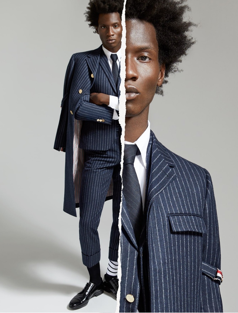 Making a sartorial statement, Adonis Bosso dons a pinstripe wool suit and coat by Thom Browne for Holt Renfrew's fall-winter 2020 campaign.