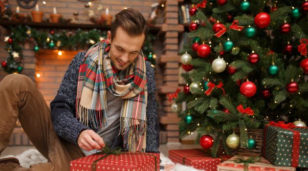 What to Get the Man in Your Life That Has Everything Man Opening Christmas Presents