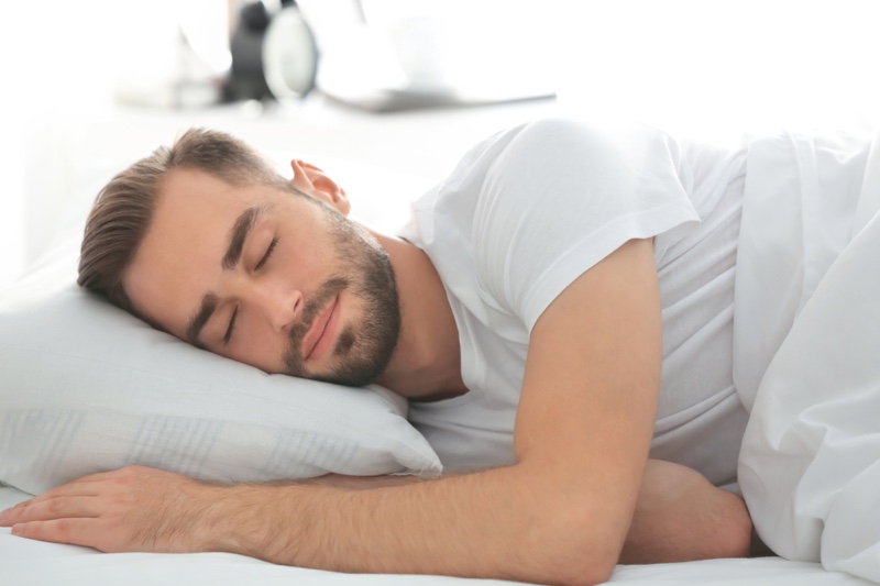 Man Smiling Sleeping Pillow Bed