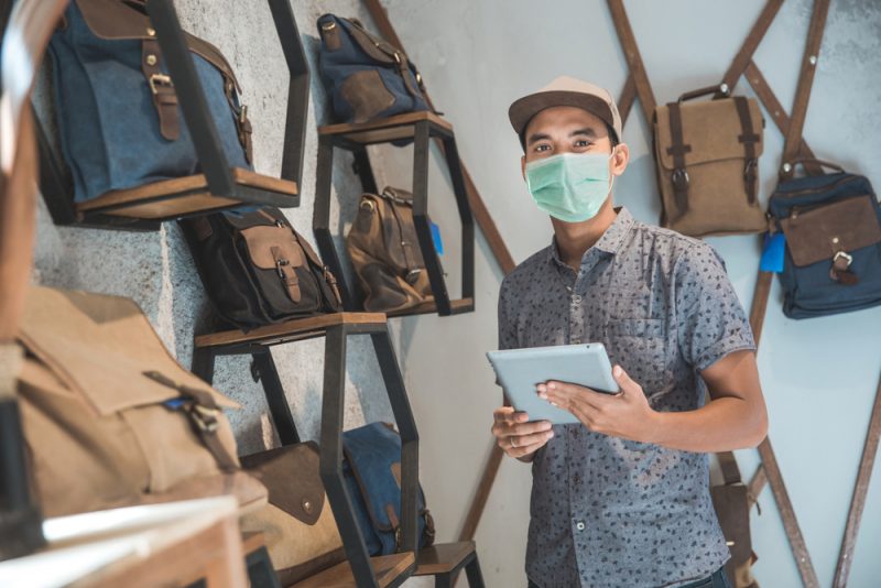 Man Wearing Mask in Bag Store