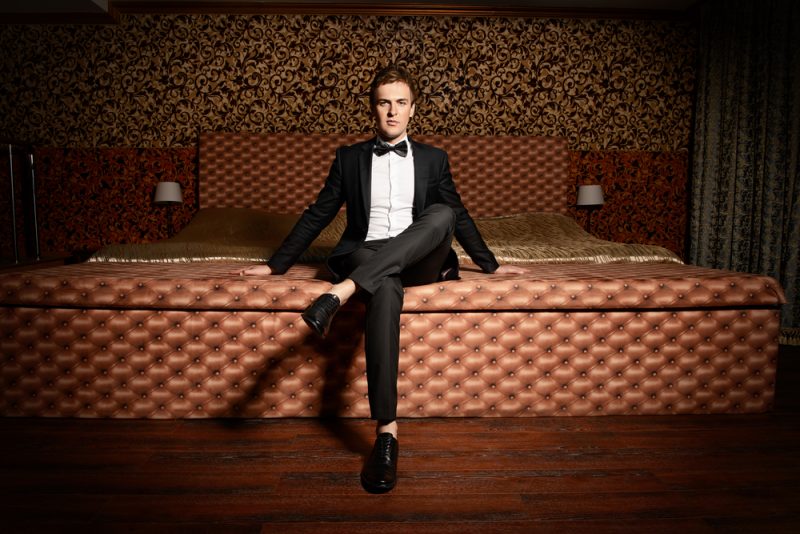 Man in Tuxedo on Bed Man in Tuxedo on Bed