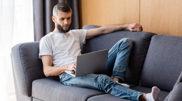 15 Life Hacks for Successful Online Dating Man on Couch on Laptop