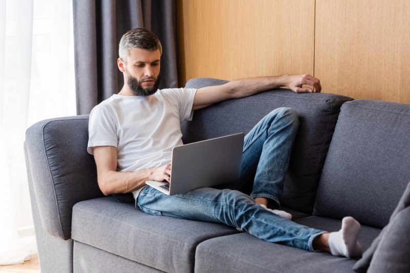 Man on Couch on Laptop