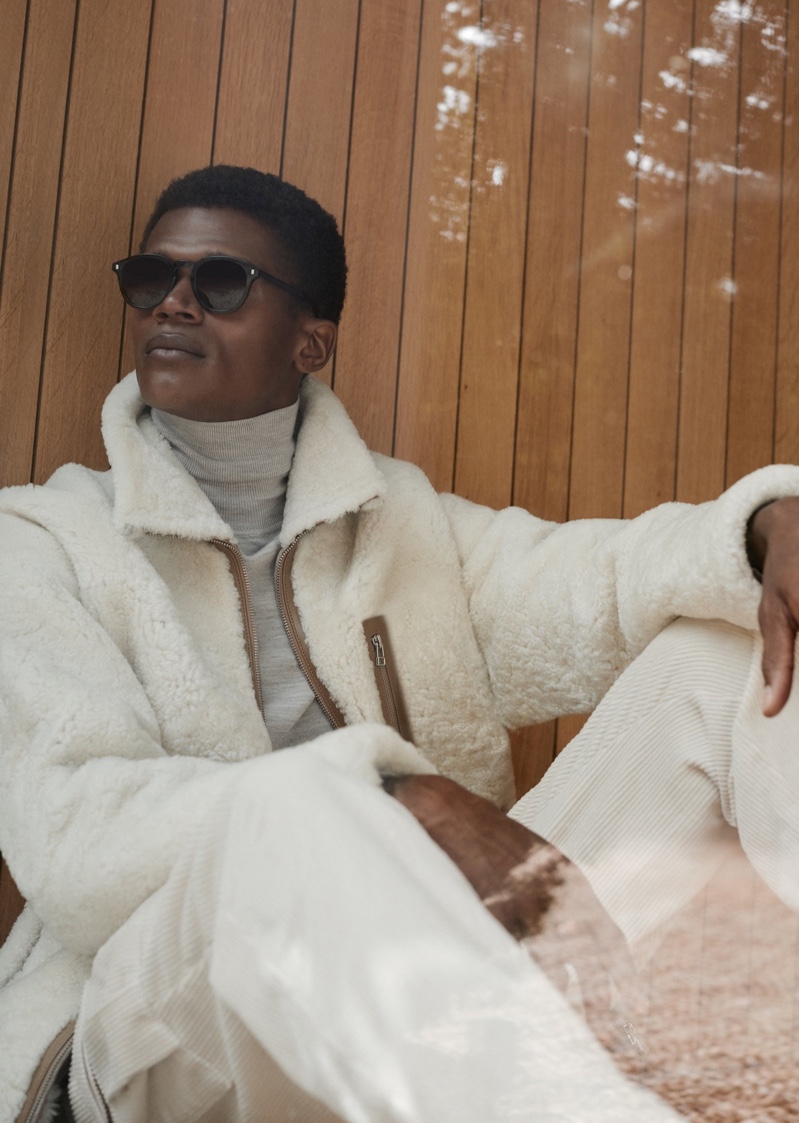 Model O'Shea Robertson relaxes in Reiss' Shaune coat, a sweater and corduroy trousers for the brand's winter 2020 campaign.