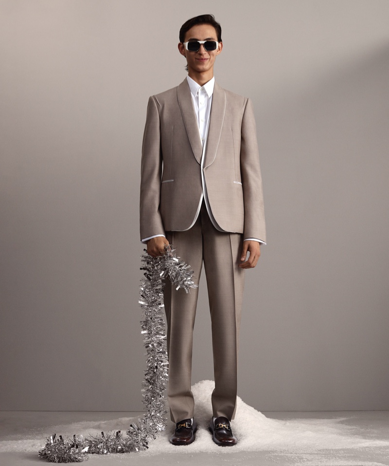 Front and center, Simon Martyn dons a sleek suit for Salvatore Ferragamo's holiday 2020 campaign.