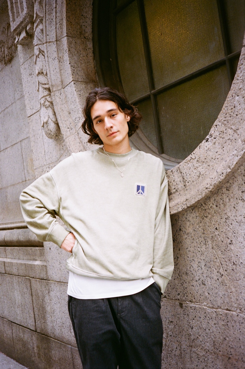 Keeping it casual, Sebastião Hungerbühler rocks Saturdays New York City's Peace sweatshirt with Dean trousers.