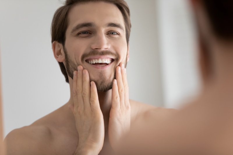 Smiling Man Mirror Grooming Skin