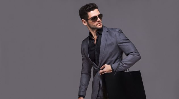 The Do's and Don’ts of Shopping for Your Fashion-Obsessed Girlfriend Stylish Male Model Suit Black Shopping Bag Luxury