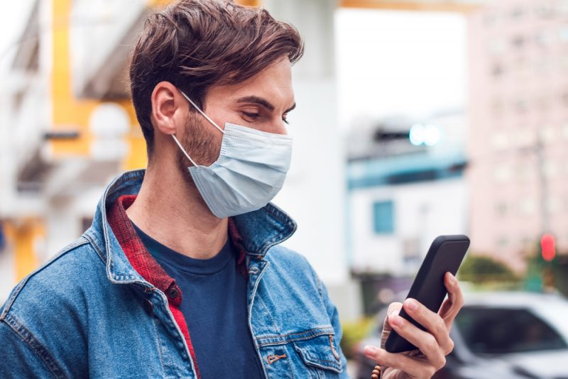 Stylish Man Outdoors in Mask