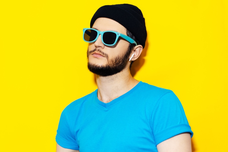 Stylish Man Wireless Earbuds Blue Shirt Sunglasses Beanie