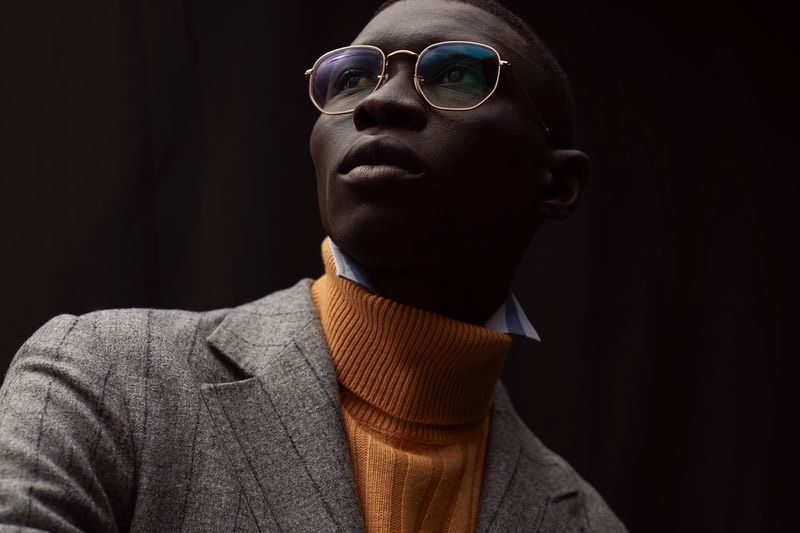 Fernando Cabral sports a suit jacket with a turtleneck sweater from Brunello Cucinelli.