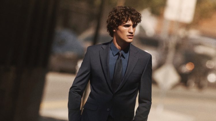 Francisco Henriques dons a sleek suit, shirt, and tie for Calvin Klein's fall-winter 2020 campaign.