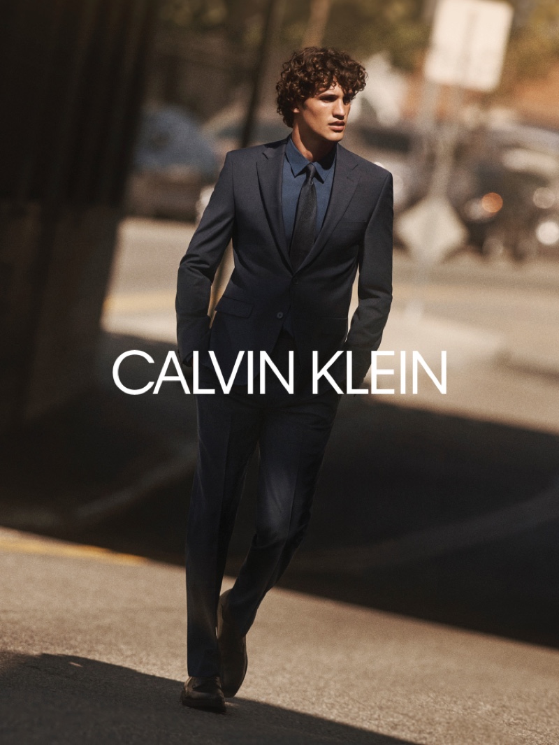 Francisco Henriques dons a sleek suit, shirt, and tie for Calvin Klein's fall-winter 2020 campaign.
