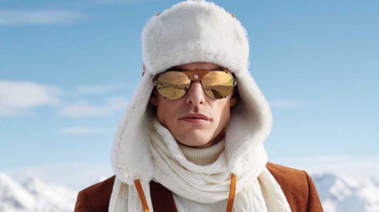 Filip Wolfe styles a sharp Carl Gross look with a trapper hat and cable-knit scarf.