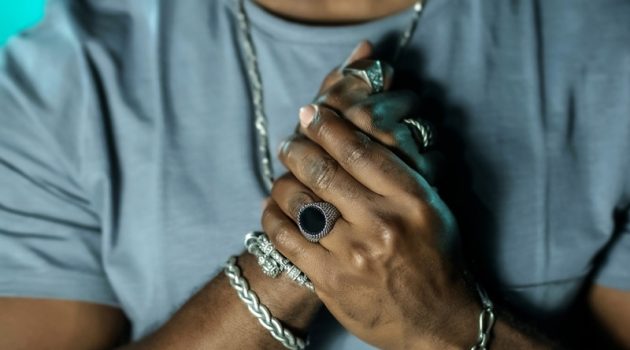 4 Errors That Individuals Keep Making While Shopping for Jewelry Online Closeup Men's Hands Jewelry Rings Bracelets