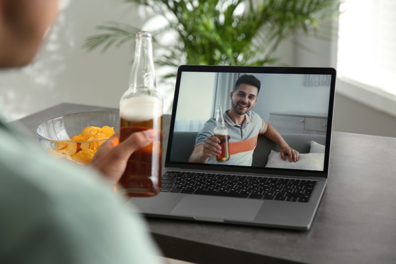 Friends Enjoying Beer Over Zoom