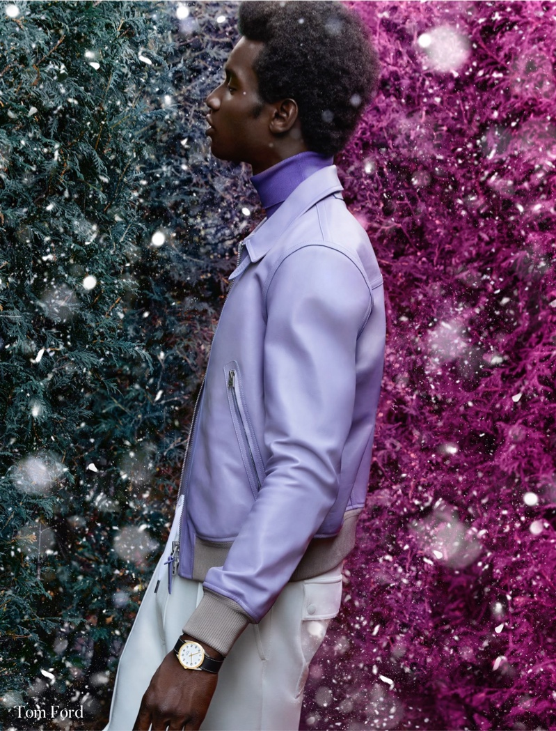 Delivering a side profile, Adonis Bosso models a lavender leather jacket from Tom Ford for Holt Renfrew.
