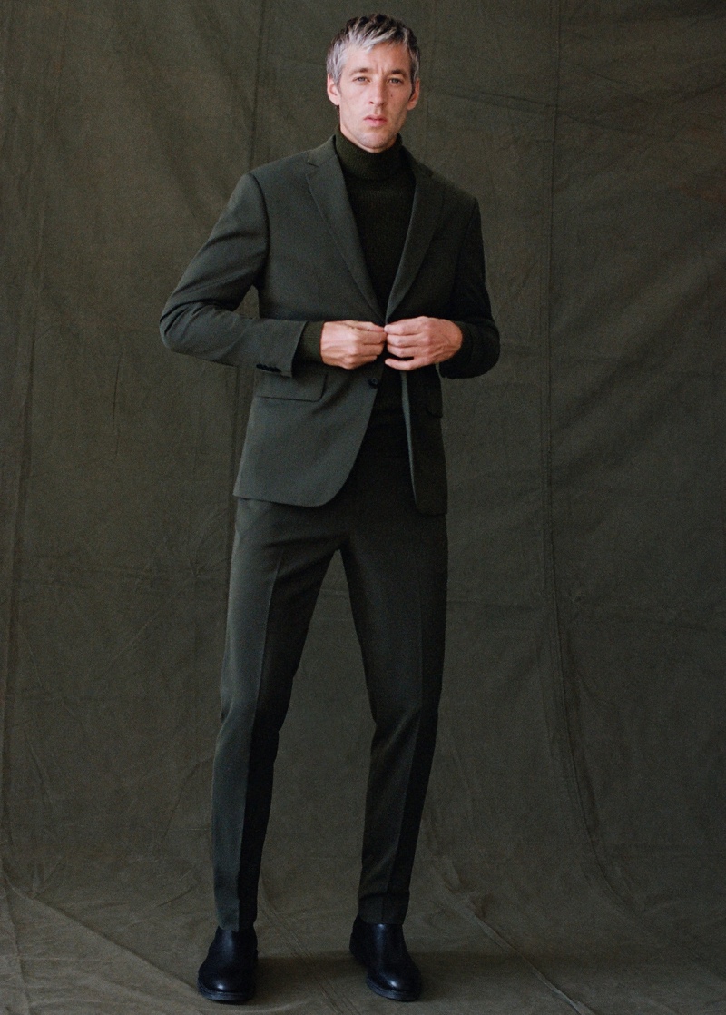 Donning a slim-fit suit, Joel Frampton wears Mango Man.