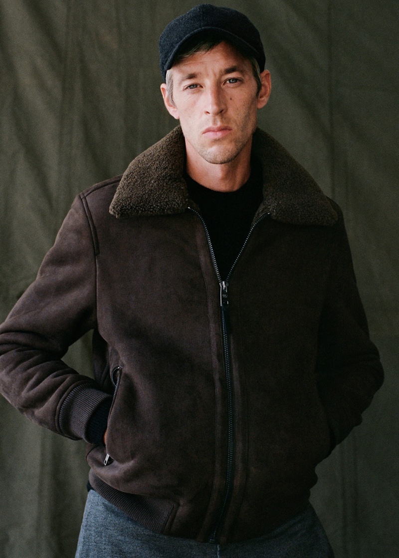 Front and center, Joel Frampton sports Mango's wool-blend baseball cap with a bomber jacket and trousers.