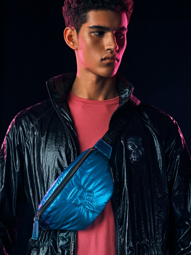 Model Bodhi Heeck sports Karl Lagerfeld's K/Ikonik metallic belt bag for the brand's holiday 2020 campaign.