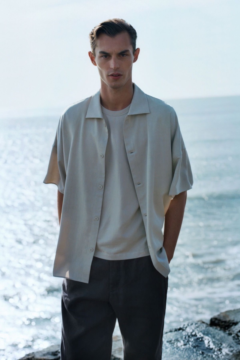 Making a case for modern proportions, Kit Butler wears one of COS's oversized short-sleeved shirts.