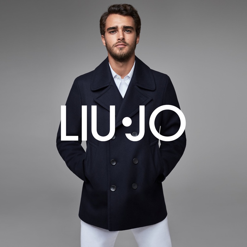 Front and center, Pepe Barroso wears a navy peacoat and white jeans for Liu Jo Uomo's fall-winter 2020 campaign.
