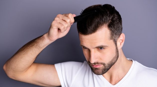 Safe and Proven Methods for Treating Male Pattern Baldness Compared Male Model Combing Hair