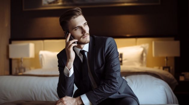 4 Ways to Do Business Travel in Style Male Model Suit Hotel Business Phone