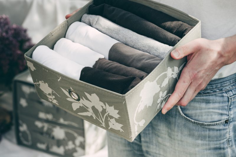 Man Organizing Closet Man Organizing Closet